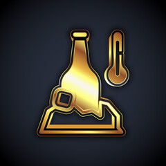 Gold Cold beer bottle icon isolated on black background. Vector