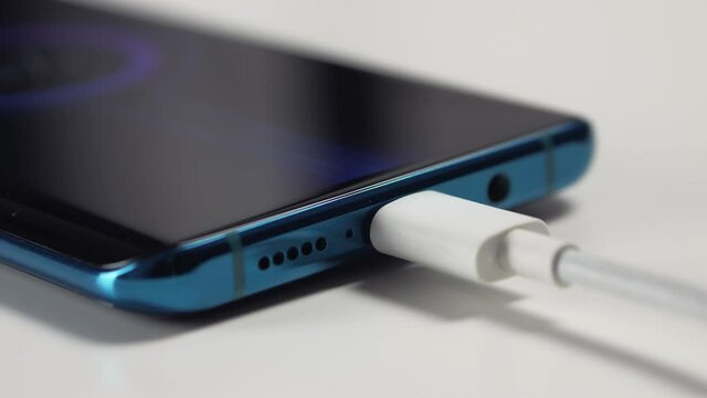 Close-up of the charging connection to your phone. Phone charging port. Charging your phone by wire.
