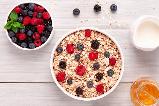 Oatmeal With Berries, Top View, Healthy Breakfast, On A White Table, No People,