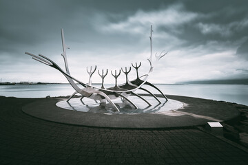 Perspective view of the Sun Voyager Sculpture against dramatic sky, Reykjavìk, Iceland - obrazy, fototapety, plakaty
