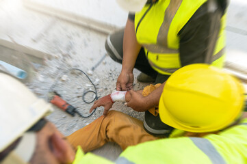 Motion blur, Safety team help first aid support employee accident in site work, Builder accident injury hand from working, First aid procedure.