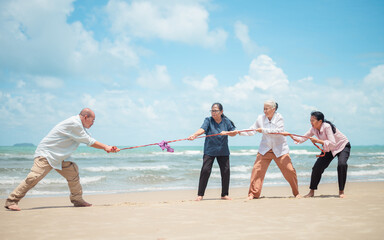 Group of elderly people play sports on vacation. hobbies during retirement