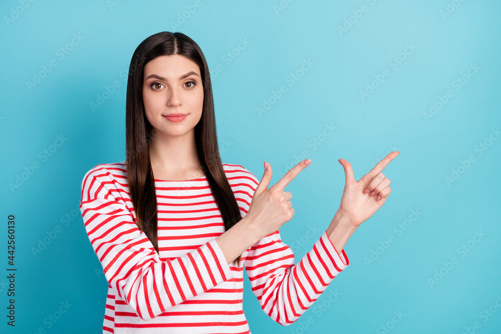 Sticker Photo of lovely brunette hairdo millennial lady point empty space wear red shirt isolated on blue color background