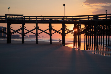 Fototapeta premium Proposal on the beach at sunrise