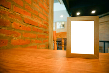 Mock up Menu frame standing on wood table in Bar restaurant cafe. space for text. Menu mack up blank for text marketing promotion