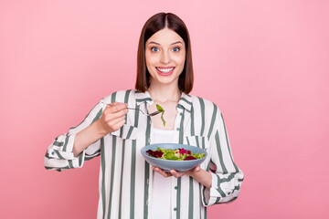 Photo of young cheerful girl happy positive smile eat salad food tasty healthy diet isolated over pastel color background