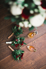 Beautiful toned picture with wedding rings against the background of a bouquet of flowers