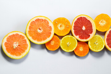 Sliced citrus on a white background. Grapefruit, lemon, tangerine.