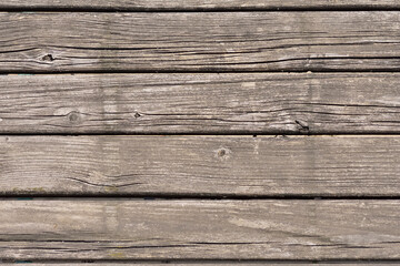 Obraz premium Old boards faded in the sun. Wood. Sun.