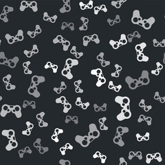 Grey Gamepad icon isolated seamless pattern on black background. Game controller. Vector