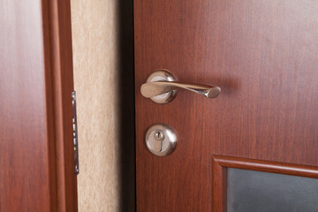 Obraz premium Open door of the living room. Wooden door.