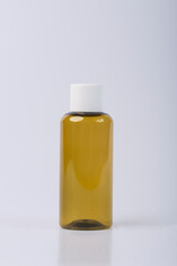 Blank cosmetic packaging mockup. Small jar for essential oils. Bottle for cosmetics on a white background. 