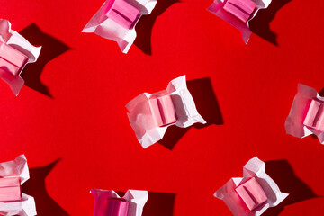 Pink gum on a red background