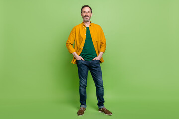 Full length photo of mature business man happy positive smile hands in pocket chief isolated over...