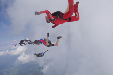 Skydiving. Formation. Skydivers are having fun in the amazing sky.