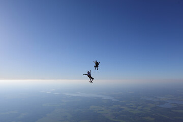 Fototapeta na wymiar Skydiving. Freefly. Skydivers are having fun in the sky.