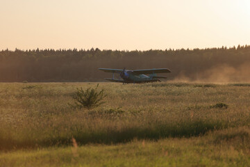 A green biplane is going to take off. © Sky Antonio