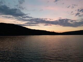 The sea coast at sunset. Sandy beach. A good place to relax with the whole family.