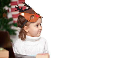 Child pretty girl dressed in deer mask. Christmas holidays concept. Copy space for your text.