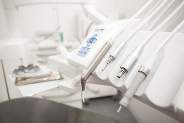 Fototapeta na wymiar Close up of dental instruments on dental chair at the clinic, copy space