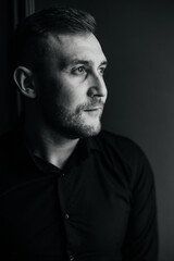 Fototapeta premium Black and white portrait of a man looking away