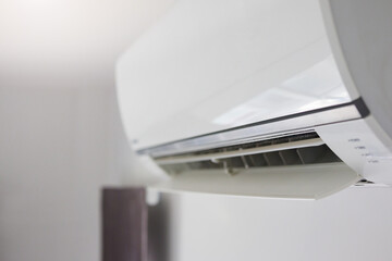 Air conditioner on white wall room interior background