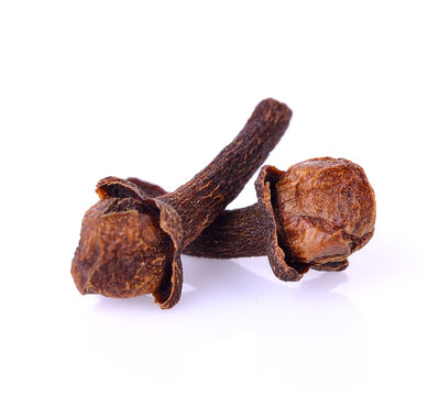 fragrant cloves ; Syzygium aromaticum on white background.