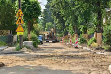 Renovation of a road in the city. Closed passage, Summer. Day.