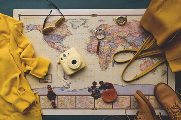 Map of the world and travel essentials flatlay