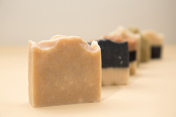 Line up of different hand made soap bar on the table