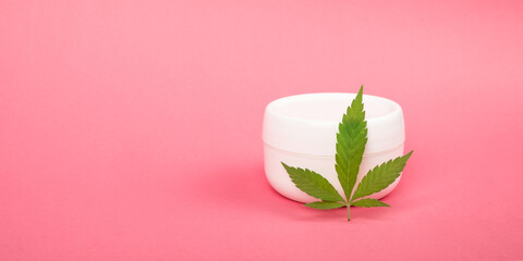 cosmetic cream for skin care and green marijuana leaf