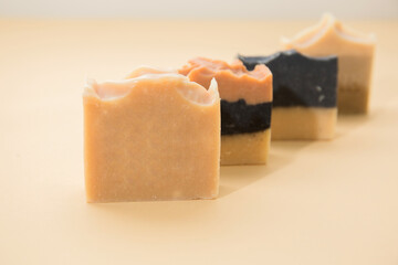 Line up of different hand made soap bar on the table