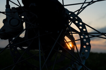 morning bike ride, disc brakes silhouette closeup.