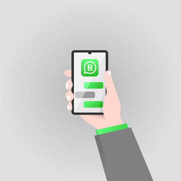 Hand holding smartphone with Whatsapp Business logo, phone mockup, vector illustration