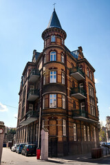 Naklejka premium a historic tenement house with a round tower in the city of Poznan 