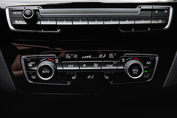 Fototapeta na wymiar Control panel car air conditioner dashboard in a modern car.