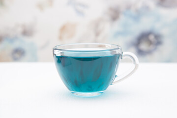 Anchan blue tea, herbal drink in glass cup