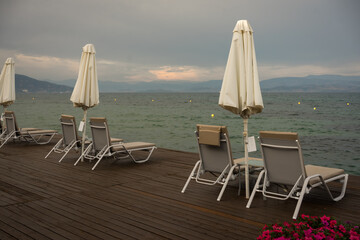table and chairs on the beach in the morning