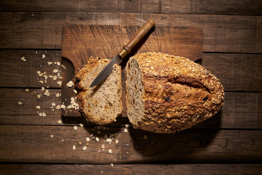Homemade bread with knife on parchment