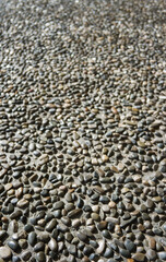 Natural cobblestone background. Stone road.