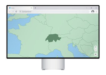 Computer monitor with map of Switzerland in browser, search for the country of Switzerland on the web mapping program.