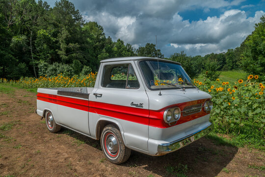 Milton, Georgia USA - June 26, 2021 Vintage Corvair Chevy truck in a farm field