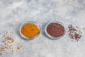 Black mustard seeds in a small bowl.