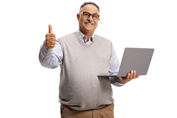 Casual mature man holding a laptop computer and gesturing a thumb up sign