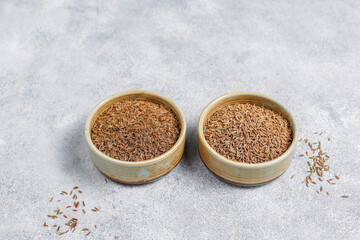 Cumin seeds in a small bowls.