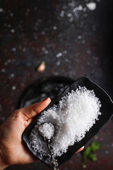 Rock salt in a dark background.