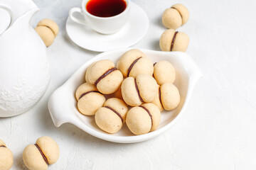 Baci di dama homemade Italian hazelnut biscuits cookies with chocolate.