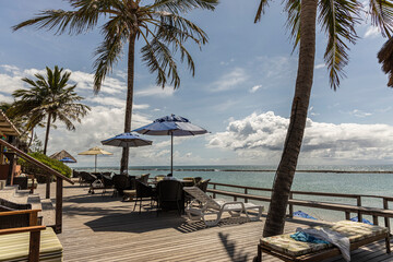 View of a hotel with chairs facing the sea, very relaxing, Barra de São Miguel, Alagoas, Brazil.