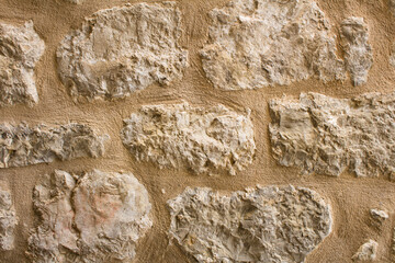 Natural background. Yellow stone wall. Close-up.