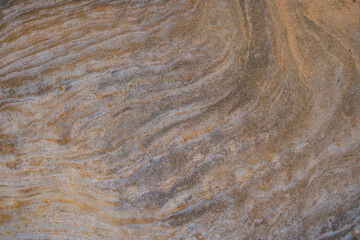 Sandy stone surface in ocher tones, design pattern